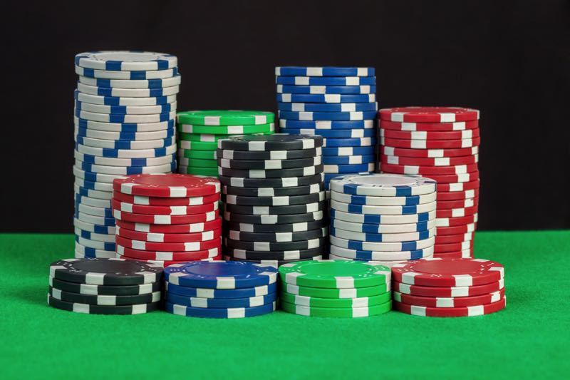 Poker chips on green table