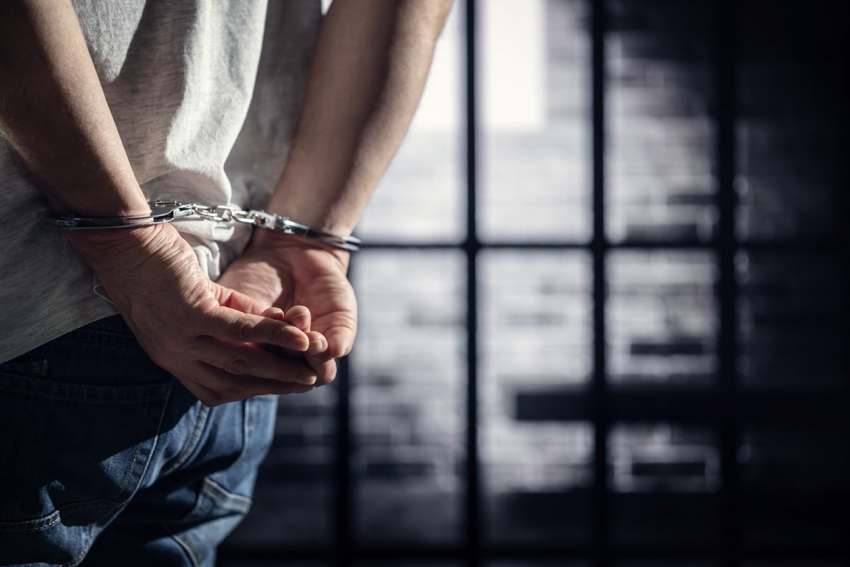 Handcuffs on hands